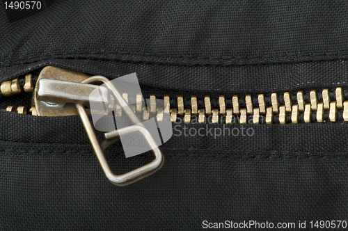 Image of Closed yellow metal zipper