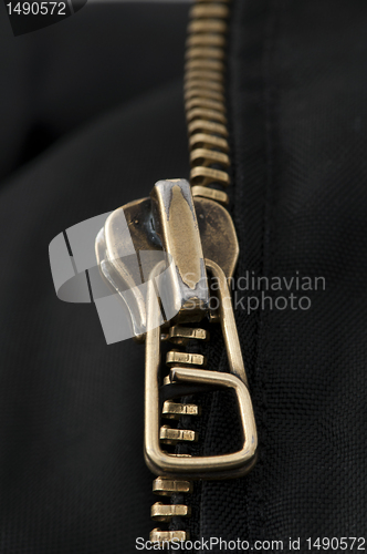 Image of Closed yellow metal zipper