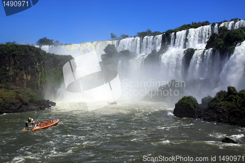 Image of Boats and waterfall