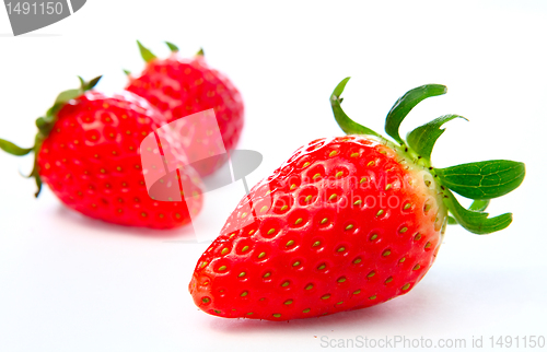 Image of Three stawberries on the white background 