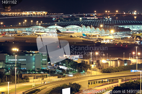 Image of Freeway in night with cars light in modern city. 