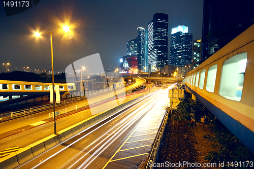 Image of urban landscape at night and through the city traffic 