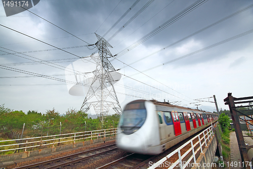 Image of speed train under the power tower