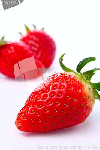 Image of Three stawberries on the white background 