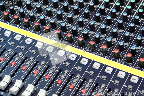 Image of buttons equipment in audio recording studio
