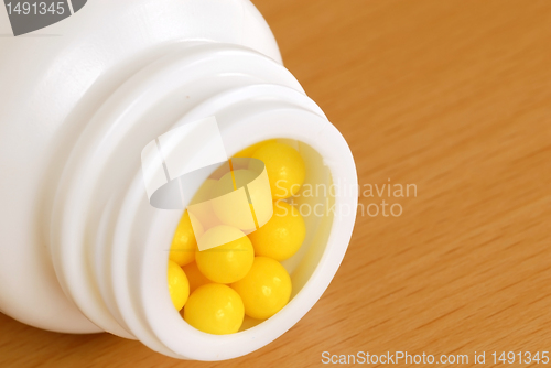 Image of Yellow dragee pills