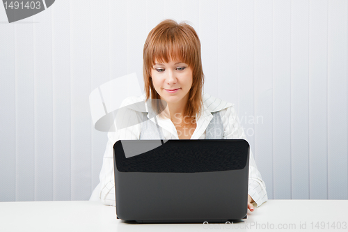 Image of Attractive girl with a laptop