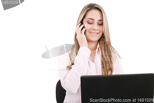 Image of Young smiling business woman with laptop and cellular 