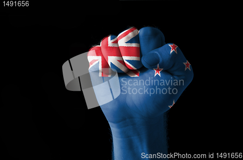 Image of Fist painted in colors of new zealand flag