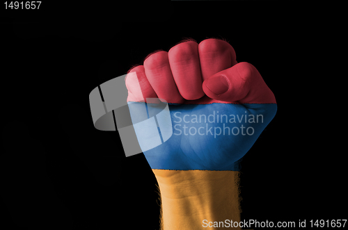 Image of Fist painted in colors of armenia flag