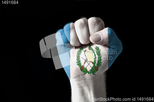 Image of Fist painted in colors of guatemala flag