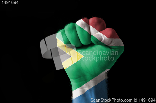 Image of Fist painted in colors of south africa flag