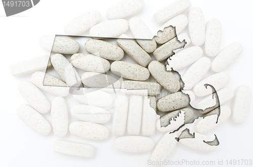 Image of Outline map of Massachusetts with transparent pills in the backg