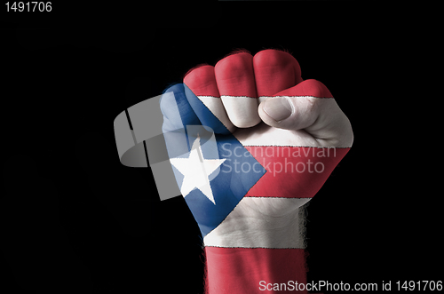 Image of Fist painted in colors of puertorico flag