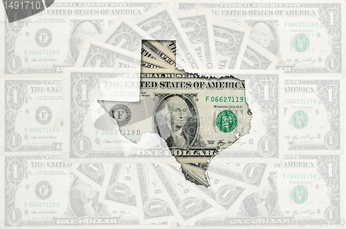 Image of Outline map of texas with transparent american dollar banknotes 