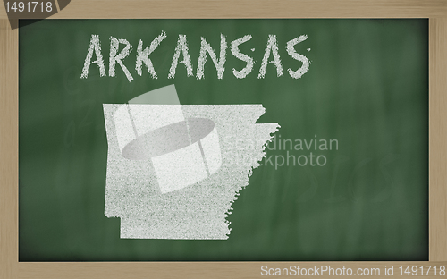 Image of outline map of arkansas on blackboard 