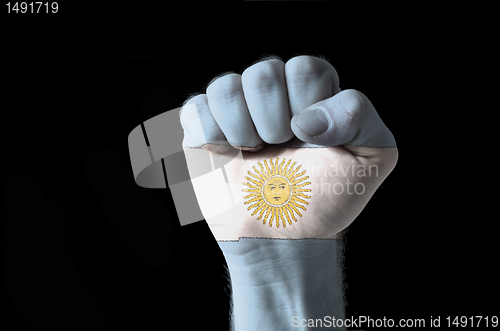 Image of Fist painted in colors of argentina flag