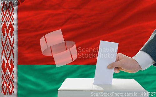 Image of man voting on elections in belarus