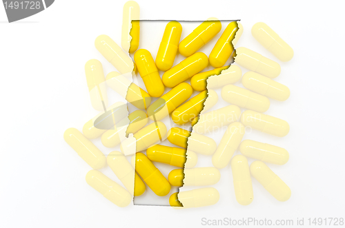 Image of Outline map of vermont with transparent pills in the background