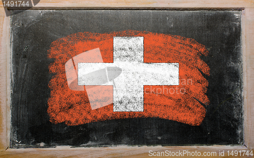 Image of flag of schwitzerland on blackboard painted with chalk  