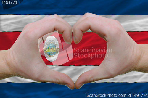 Image of Heart and love gesture showed by hands over flag of costa rica b