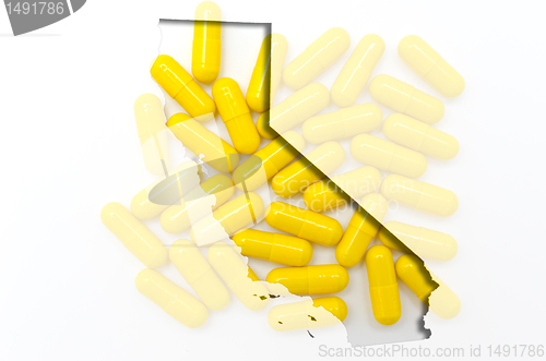 Image of Outline California map of with transparent pills in the backgrou