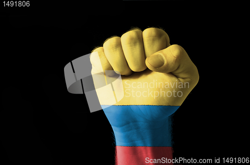 Image of Fist painted in colors of columbia flag