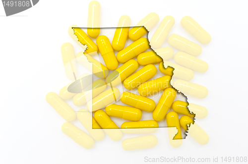 Image of Outline map of missouri with transparent pills in the background