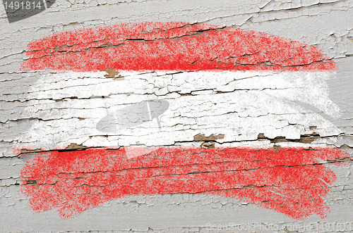 Image of flag of Austria on grunge wooden texture painted with chalk  