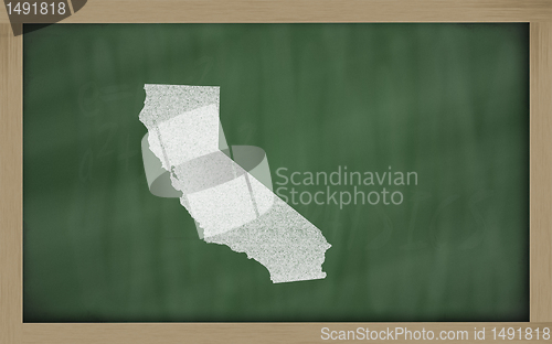 Image of outline map of california on blackboard 