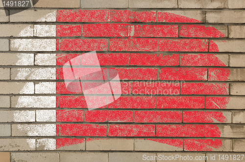 Image of flag of bahrain on grunge brick wall painted with chalk  