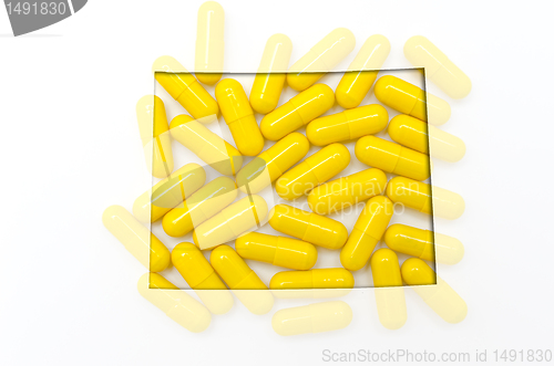 Image of Outline map of wyoming with transparent pills in the background