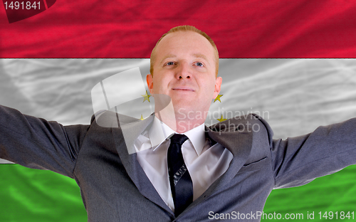Image of happy businessman because of profitable investment in tajikistan