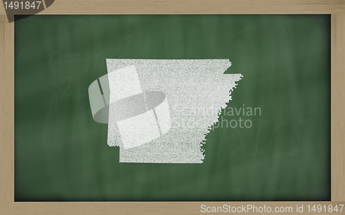 Image of outline map of arkansas on blackboard 