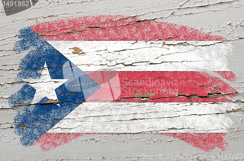 Image of flag of puertorico on grunge wooden texture painted with chalk  