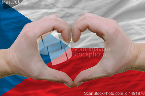 Image of Heart and love gesture showed by hands over flag of czech backgr