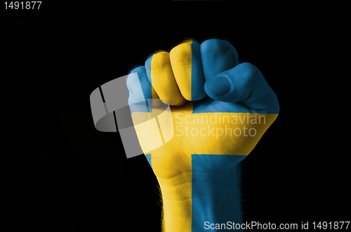 Image of Fist painted in colors of sweden flag