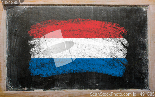 Image of flag of Netherlands on blackboard painted with chalk  