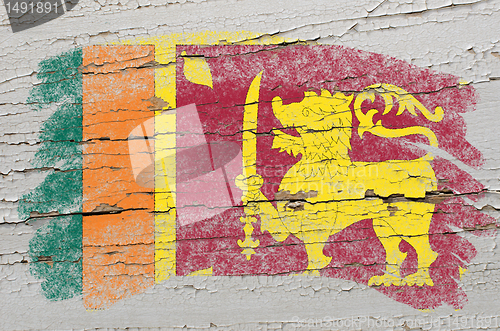 Image of flag of  srilanka on grunge wooden texture painted with chalk  