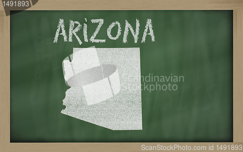 Image of outline map of arizona on blackboard 