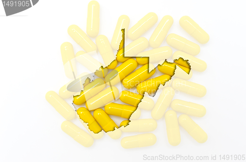 Image of Outline map of west virginia with transparent pills in the backg