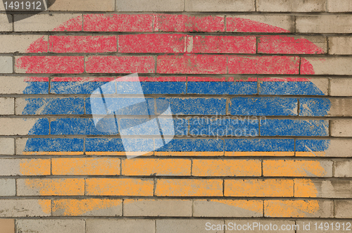 Image of flag of armenia on grunge brick wall painted with chalk  