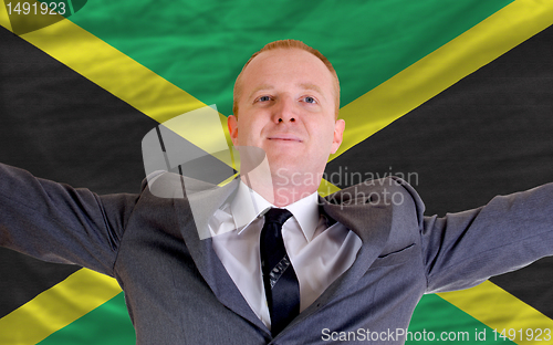 Image of happy businessman because of profitable investment in jamaica st