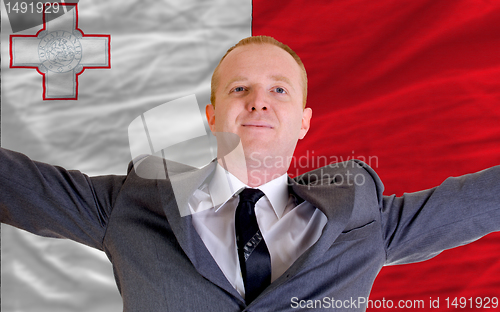 Image of happy businessman because of profitable investment in malta stan