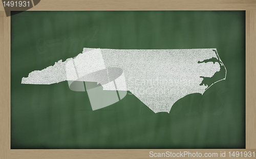 Image of outline map of north carolina on blackboard 