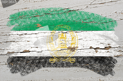 Image of flag of afghanistan on grunge wooden texture painted with chalk 