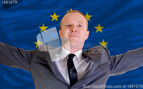 Image of happy businessman because of profitable investment in europe sta