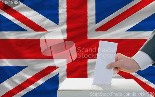 Image of man voting on elections in great britain