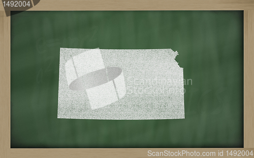 Image of outline map of kansas on blackboard 