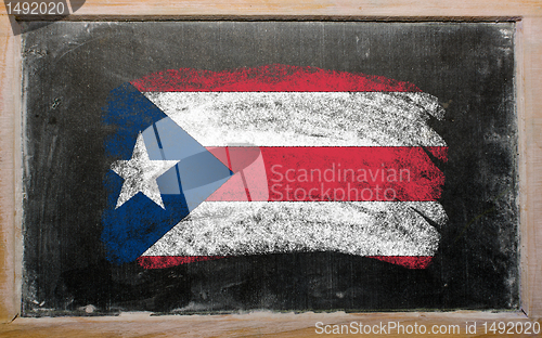 Image of flag of puertorico on blackboard painted with chalk  